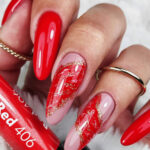 Red manicure with Claresa gel polish – elegant glossy red nails for a classic nail look.