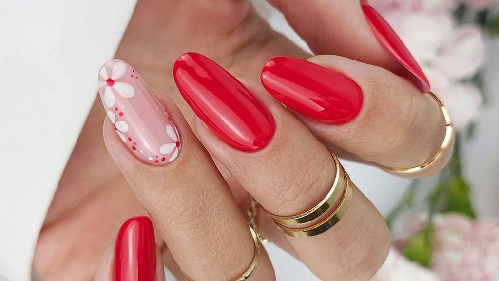 Applying Claresa red gel nail polish for a professional manicure
