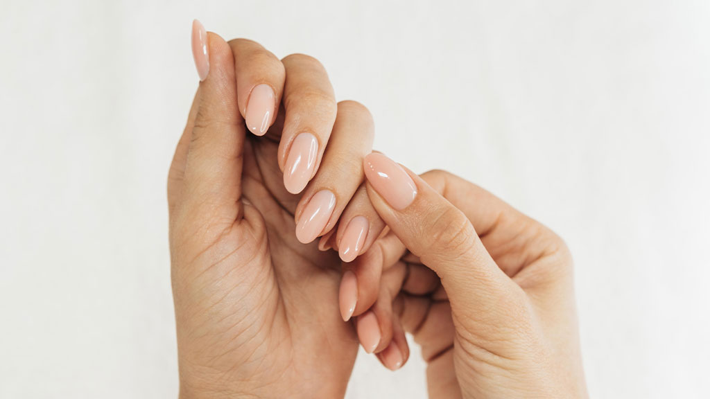 Gel polish nail starter kit with LED lamp including gel polish, base coat, top coat and manicure tools for at-home gel nails.